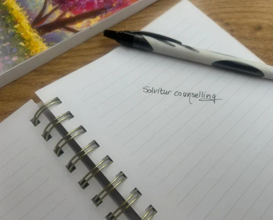 Solvitur Counselling written in a notebook.